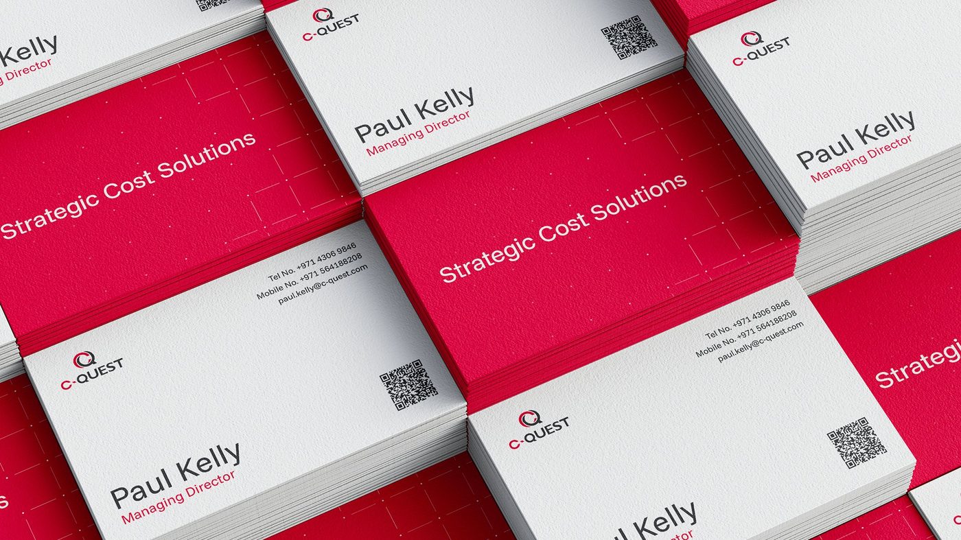 C-Quest business card stack detail showing Paul Kelly, Managing Director, with strategic cost solutions wordmark