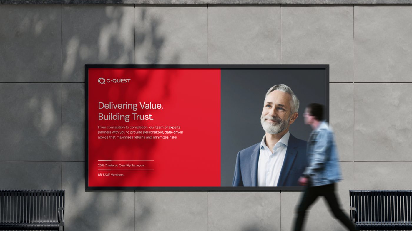 C-Quest horizontal wall billboard: Delivering Value, Building Trust, with portrait, 25% Chartered Quantity Surveyors, 8% SAVE Members