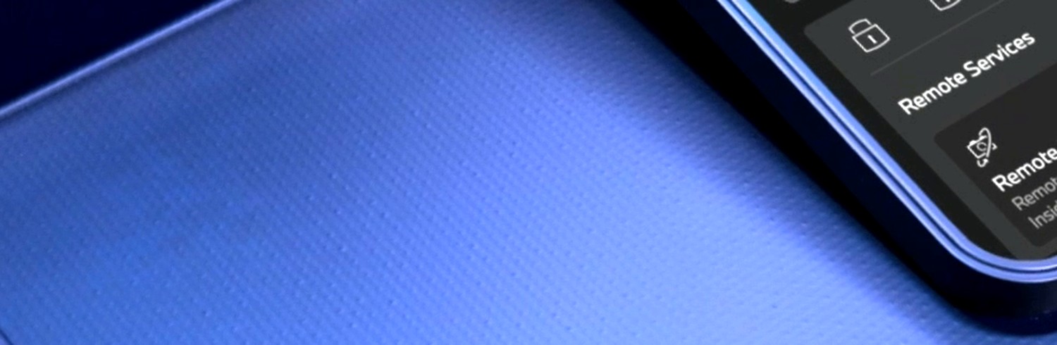 Macro close-up of the carbon-fibre weave and BMW gradient
