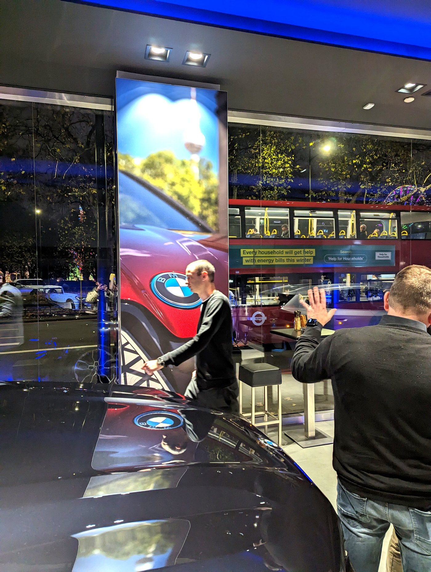 Pillar graphic beside a BMW on the floor